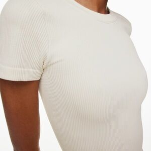 Pink Rose winter white crewneck style top with a fitted, ribbed texture.